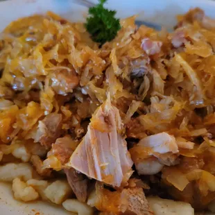 a plate of sauerkraut and potatoes