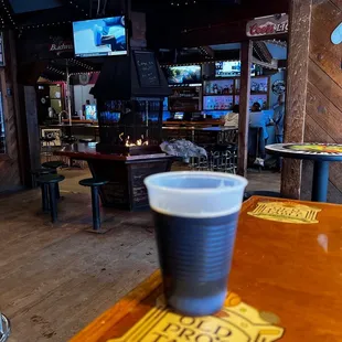 a cup of beer on the table