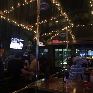 people sitting at a bar