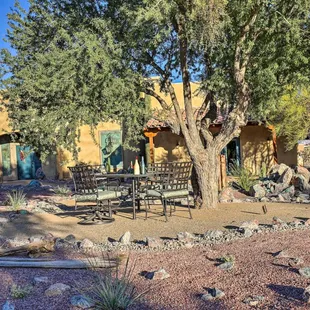 a patio with a table and chairs