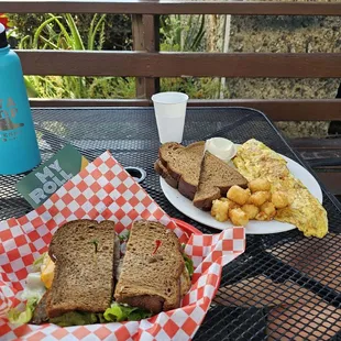 My breakfast sandwich on squaw and her omelet plate