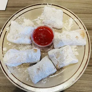 Beignets with strawberry sauce