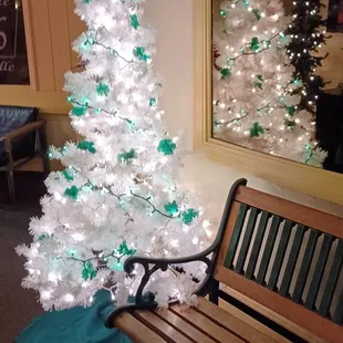 a christmas tree and a bench