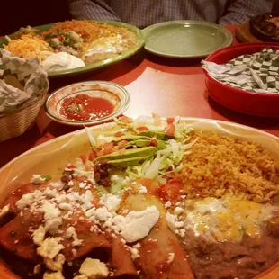 Tacos Rancheros with shrimp fajitas in the background.