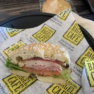 a ham sandwich with lettuce and tomato