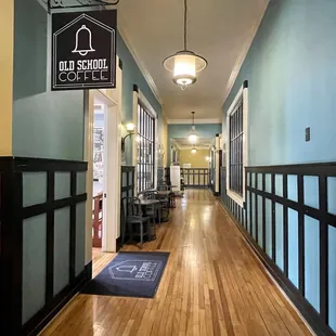 a hallway leading to a coffee shop