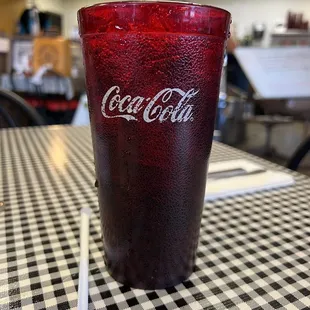 a coke glass on a table