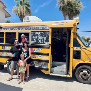 a family standing in front of it