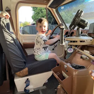 My nephew was obsessed and even got a chance to sit in the driver's seat for a photo!