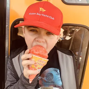 Hutch enjoying a sweet cherry snow cone!