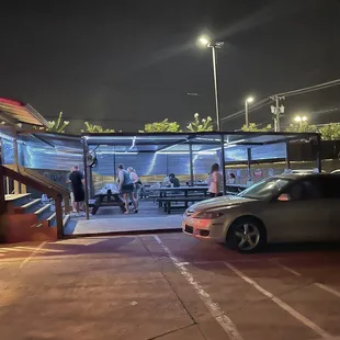 Outside of the back of the building where you're welcome to eat