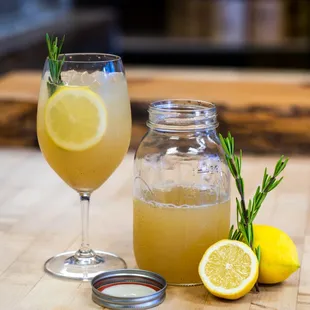 a glass of lemonade and a lemon slice