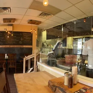Inside. Small. Clean. Love that you can see the making of pizzas.