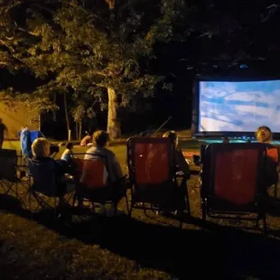 a group of people watching a movie