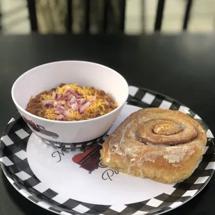 a bowl of soup and a roll