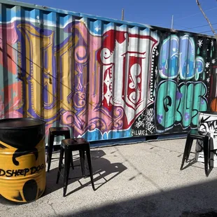 graffiti on the side of a shipping container