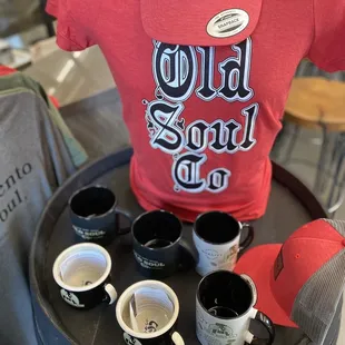 a t - shirt and cups of coffee