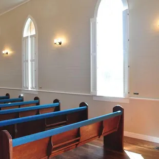 Inside, window shutters open or closed.