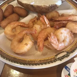 Shrimp and baked potato.