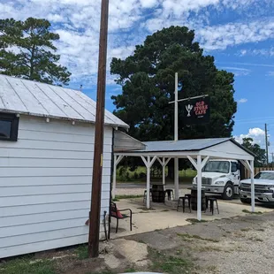 a white truck parked in front of a white building