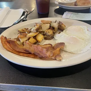 Two eggs over easy, bacon, home fries and biscuit and gravy.