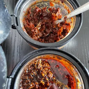Hot sauces. The choppy one on top is sour &amp; salty. Love! The fried one on the bottom is smoky &amp; crispy. Also love!!