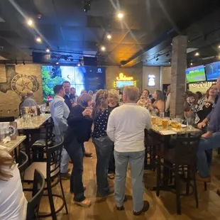 a large group of people at a bar