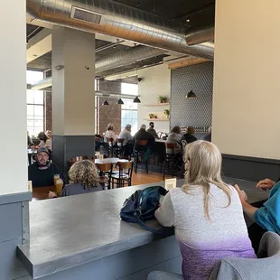 customers sitting at the bar