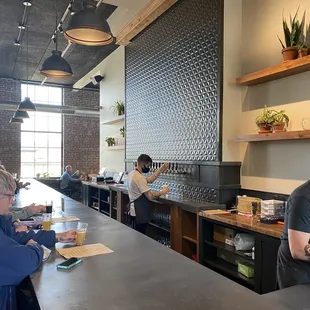 a man and a woman sitting at a bar