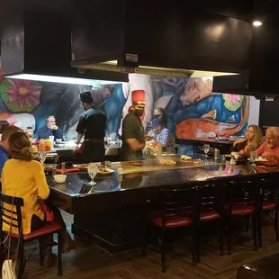 a group of people sitting at a table