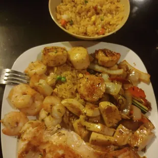 Salmon, shrimp, scallops, calamari, veggies and fried rice.