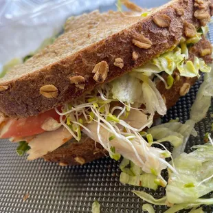 Honey wheat bread toasted loaded with lots of turkey breast and crips fresh veggies!