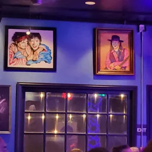 a group of people sitting at a bar