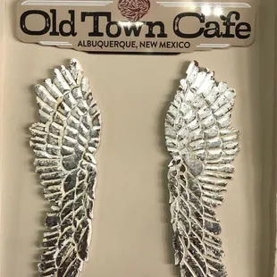 two wings in a display case