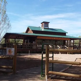 an old barn with a green roof