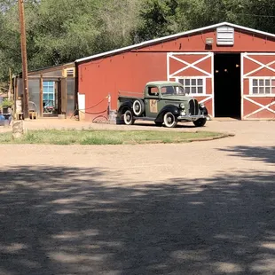 Barn that is next to outdoor seating area