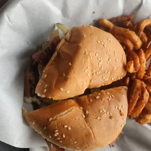 Bacon cheeseburger with curly fries already cut up for us for easy consumption! :)