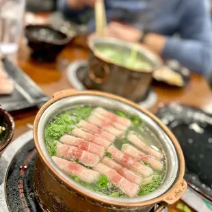 a man eating a bowl of soup