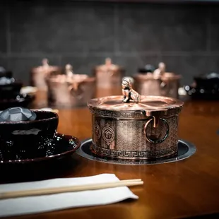 a wooden table with a cup of coffee