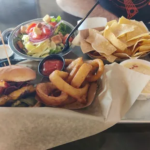 Burger, salad, onion rings and chips with queso dip!