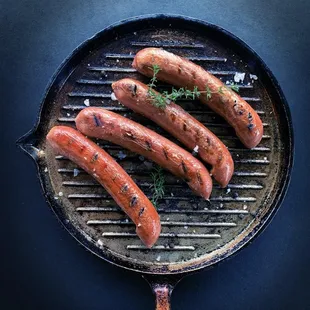 grilled hot dogs on a grill