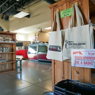 a grocery store with a train in the background