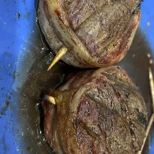 Their bacon-wrapped filets grilled on a Traeger grill