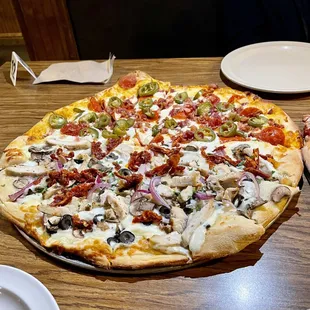 two pizzas on a table
