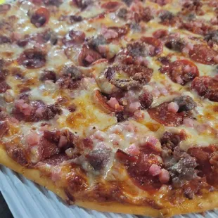 Brutus pizza - pepperoni, ham, bacon, sausage with extra sauce