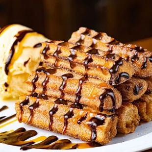a stack of waffles and ice cream