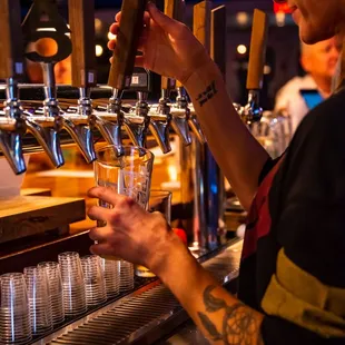 a bartender pouring a drink
