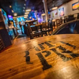 a wooden table with the word pub written on it