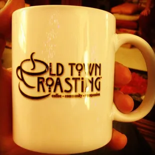 a person holding a coffee mug