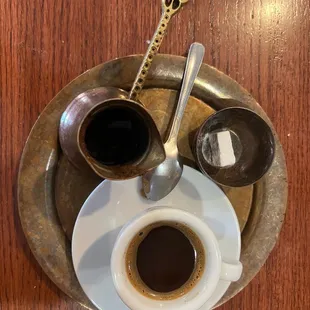 a cup of coffee and a spoon